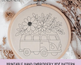 May include: A hand embroidery pattern featuring a black and white illustration of a vintage van with flowers on top, set in a wooden embroidery hoop. The text "PRINTABLE HAND EMBROIDERY PDF PATTERN" is at the bottom.