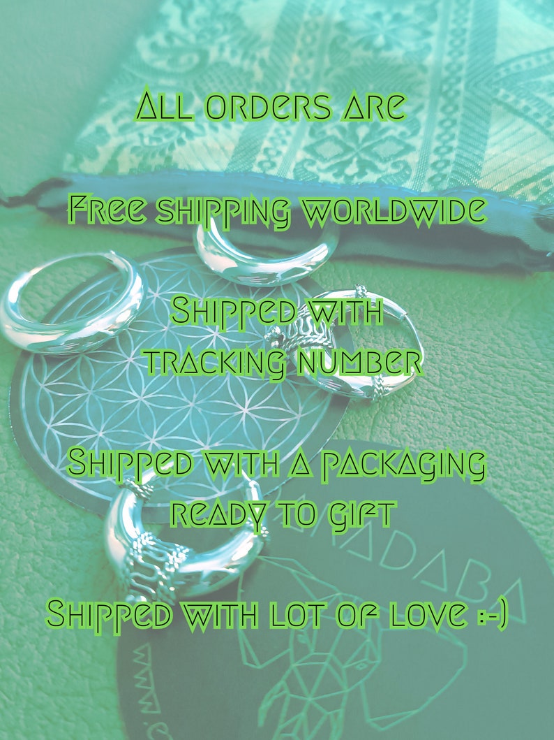 May include: A close-up of silver rings and a silver hoop earring on a green background with the text "ALL ORDERS ARE FREE SHIPPING WORLDWIDE SHIPPED WITH TRACKING NUMBER SHIPPED WITH A PACKAGING READY TO GIFT SHIPPED WITH LOT OF LOVE :-) :-) www."