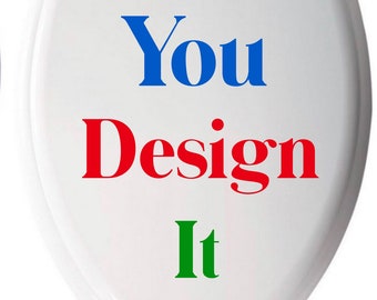May include: White toilet seat with the words "You Design It" in blue, red, and green lettering.