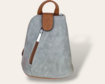 Mini mochila cruzada gris: un elegante bolso de viaje pequeño