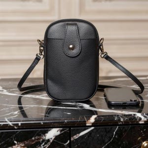Bolso/bolsa de cuero negro para teléfono móvil, cruzado al hombro. Standard