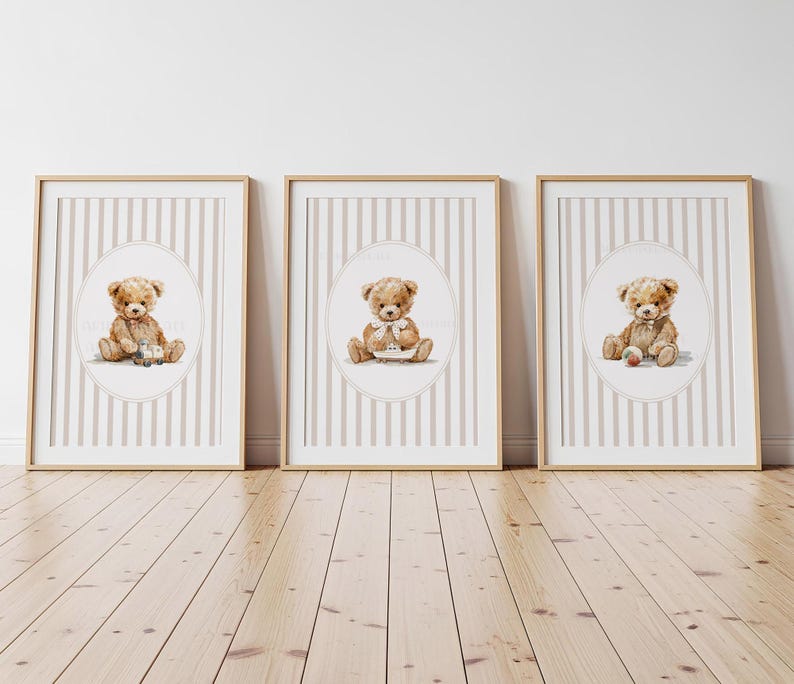 May include: Three framed prints featuring watercolor illustrations of teddy bears. Each bear is depicted in a seated position, with one holding a toy car, another holding a small house, and the third with a ball. The backgrounds have a striped pattern.