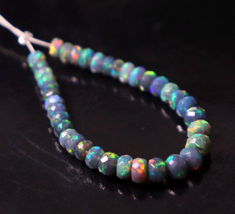 Natural Black Ethiopian Welo Fire Opal Faceted Rondelle 4-5.5mm Graduated AAA Quality Sparkly Beads for Jewelry Making , 7 , 14 Strand - UK Natural Black Ethiopian Welo Fire Opal Faceted Rondelle 4-5.5mm Graduated AAA Quality Sparkly Beads for Jewelry Making , 7 , 14 Strand - UK