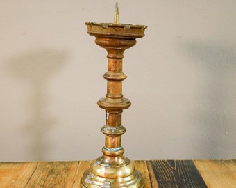 Noble, antique brass candlestick