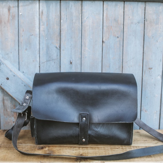 Old, black leather mail bag