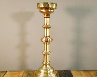 Antique brass candlestick with patina