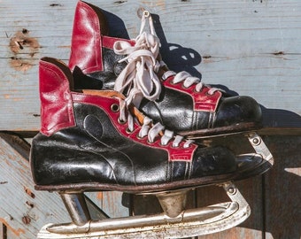 Old vintage ice skates in red and black