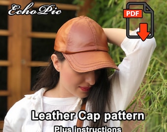 Könnte beinhalten: Eine braune Leder-Baseballkappe mit einem PDF-Download-Symbol. Der Text "Leather Cap pattern Plus instructions" befindet sich unter der Kappe.