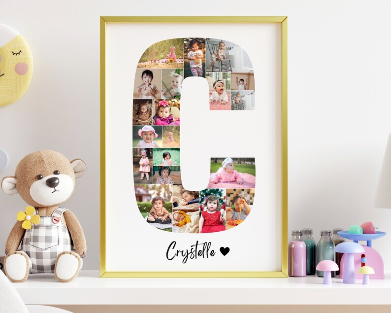 May include: A gold framed print with a white background featuring a collage of photos of babies arranged in the shape of the letter C. The name "Crystalle" is written below the letter with a heart symbol.