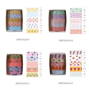 May include: Set of four packs of colorful washi tape with various patterns. Each pack contains five rolls of tape, each measuring 1 cm wide. The patterns include flowers, leaves, hearts, and geometric shapes.
