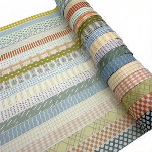 May include: A collection of decorative adhesive tape rolls arranged in a row, featuring a variety of patterns including checkered, plaid, wavy lines, dots, and stripes in a color palette of muted orange, sage green, light blue, and cream.