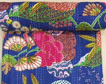 May include: A blue kantha quilt with a floral pattern in shades of pink, orange, yellow, green, and white. The quilt is hand-stitched and has a traditional Indian design.
