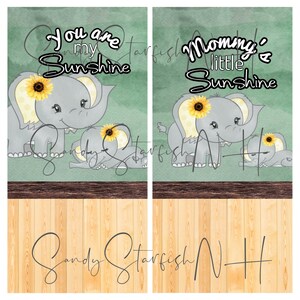 May include: Two gray elephant illustrations with yellow sunflowers on their heads. The larger elephant is standing and the smaller elephant is lying down. The text "You are my Sunshine" is above the elephants. The text "Mommy's little Sunshine" is above the elephants on the right side of the image.