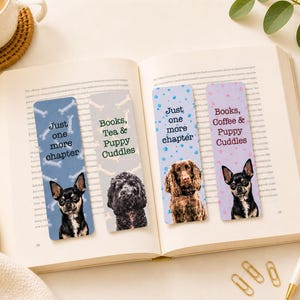 May include: Four dog-themed bookmarks are displayed open in a book. The bookmarks have different backgrounds and dog breeds. Text on the bookmarks reads "Just one more chapter" and "Books, Tea & Puppy Cuddles" and "Books, Coffee & Puppy Cuddles".