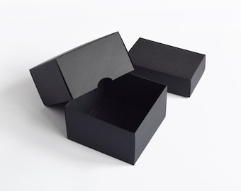 BLACK Storage Box for # 7 Glassine Envelopes., 14-1/4 x 7 x 4-3/4., Made  from .040 thick chipboard. , Wrapped in embossed black paper. 2