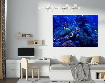 May include: A vibrant underwater scene with coral reefs and colorful fish. The image features a variety of fish, including yellow, orange, and red fish, swimming among the coral. The background is a deep blue, creating a sense of depth and tranquility.