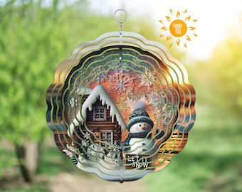Könnte beinhalten: Dekorative Winterlandschaft mit Schneemann, Hütte und Schneeflocken in mehreren Ebenen. Das Design ist in einem wellenförmigen, mehrfarbigen Metallrahmen mit einer Aufhängeschlaufe eingefasst. Der Text "LET IT SNOW" ist sichtbar.