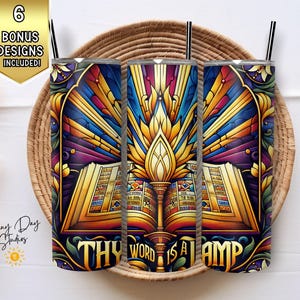May include: Three stainless steel tumblers with a colorful design featuring a book with the words "Thy Word is a Lamp" and a flame. The design is reminiscent of stained glass.