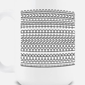 May include: White ceramic mug with a black geometric pattern. The design features rows of various shapes, including arches, chevrons, and circles. The mug has a curved handle and a smooth, glossy finish.
