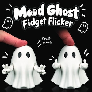 May include: A white ghost-shaped fidget toy with black eyes. The text reads Mood Ghost Fidget Flicker and Press Down. The toy features articulated arms that move between a peace sign gesture and a middle finger gesture when the head is pressed.