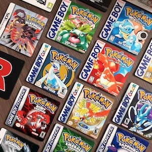 May include: A collection of Nintendo video game cartridges for Game Boy, Game Boy Color, Game Boy Advance, and Nintendo DS, featuring various Pokémon titles including Platinum, Green, Blue, Silver, Red, Ruby, Gold, Crystal, Diamond, Emerald, and Sapphire.