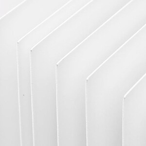 May include: A close-up of a white, textured surface with a series of parallel lines creating a geometric pattern.
