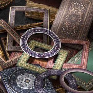 May include: An assortment of decorative paper frames with intricate patterns and designs in shades of brown, green, purple, and blue. The frames are layered and overlapping, creating a visually appealing collage.