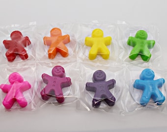 May include: Eight individually packaged gingerbread man-shaped candles in a rainbow of colors: red, orange, yellow, green, pink, purple, blue, and teal.