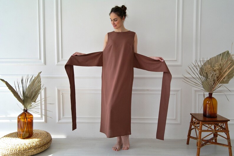 Women's kimono linen dress showing kimono-style sleeves, long waist ties, and relaxed fit