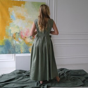 Women's pleated maxi linen dress back view showing pleated skirt