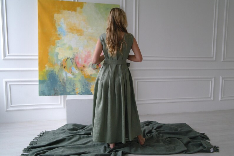 Women's pleated maxi linen dress back view showing pleated skirt