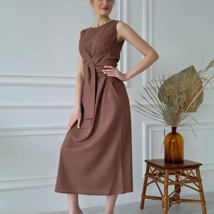 Women's kimono linen dress showing crew neckline, waist tie, and relaxed silhouette