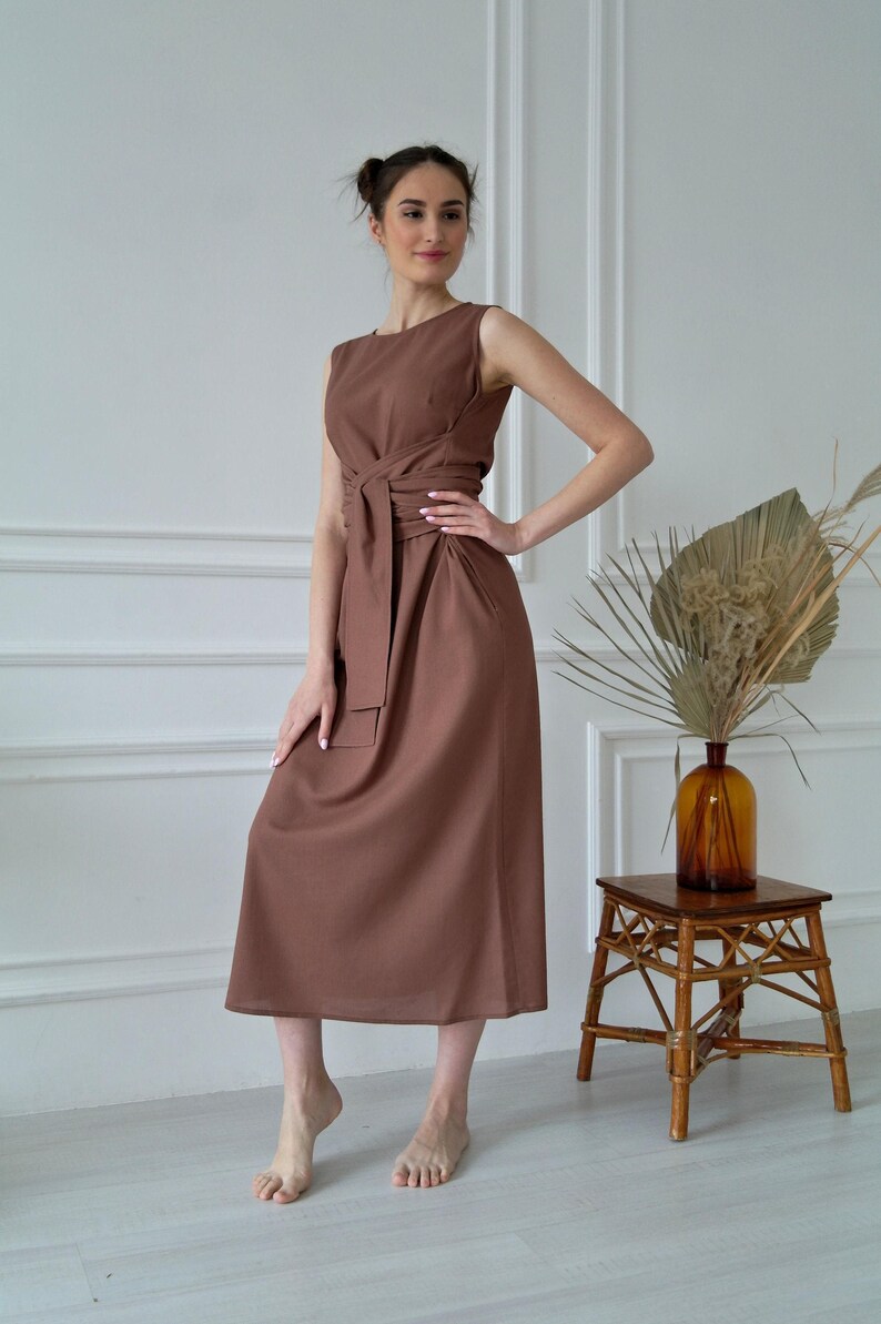 Women's kimono linen dress showing crew neckline, waist tie, and relaxed silhouette