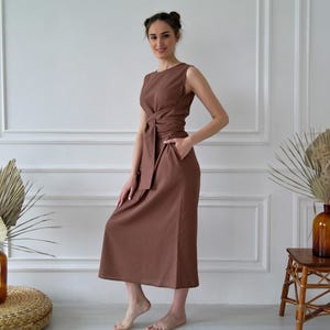 Women's kimono linen dress showing long waist ties and relaxed straight silhouette