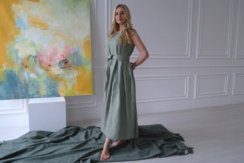 Women's pleated maxi linen dress showing waist tie and pleated skirt