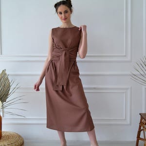 Women's kimono linen dress showing waist tie and relaxed fit