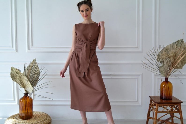 Women's kimono linen dress showing waist tie and relaxed fit