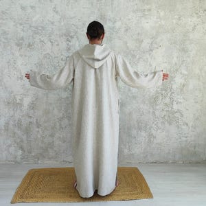 Men's Undyed Hooded Linen Kaftan with Button Front Side Slits and Deep Pockets, back view showing overall shape, construction and linen drape.