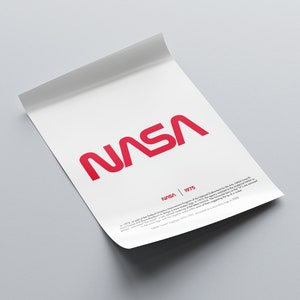 May include: A white poster with the red NASA logo and the text "NASA | 1975". The text below the logo explains that the logo was created as part of the National Endowment for the Arts.