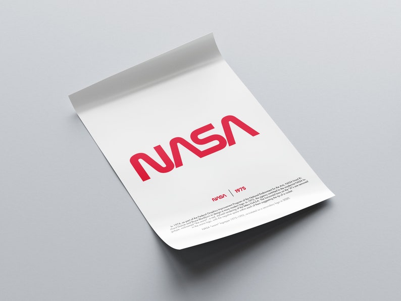 May include: A white poster with the red NASA logo and the text "NASA | 1975". The text below the logo explains that the logo was created as part of the National Endowment for the Arts.