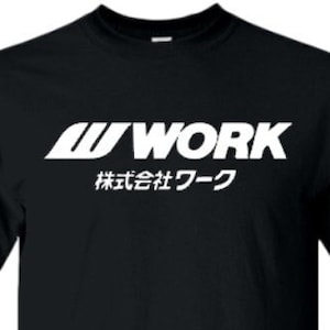 May include: Black t-shirt with a white "WORK" logo and the Japanese text "株式会社ワーク" (Kabushiki-gaisha Wāku) underneath.