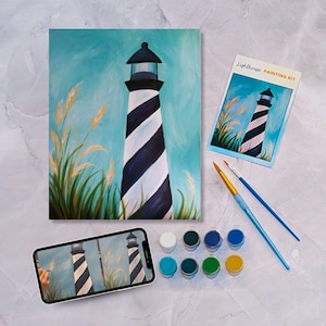 May include: A paint-by-numbers kit featuring a lighthouse with black and white stripes against a blue sky. The kit includes a canvas, paint tubes, brushes, and a reference image.  The kit is labeled "Lighthouse Painting Kit".
