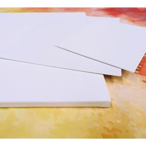 May include: Four white canvases of different sizes stacked on top of each other. The canvases are blank and ready for painting.