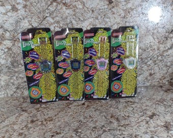 May include: Four Little Puppy virtual pet toys in their original packaging. Each package features a digital pet watch with a screen and buttons. The packaging has the text "Little Puppy" and phrases like "I am hungry" and "Want to play?"