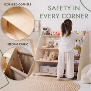 May include: A light-colored wooden bookshelf with rounded corners and strong fabric accents. The bookshelf has multiple shelves filled with books and stuffed animals. The text "SAFETY IN EVERY CORNER" is displayed on the image.