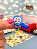 Miniature dollhouse playroom toys cars and blocks