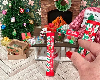 Miniature dollhouse Christmas wrapping supplies like giftwrap, bows, gift tags, and ribbon