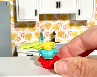 Miniature dollhouse plastic food containers similar to tupperware