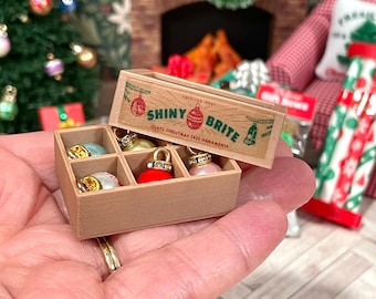 Miniature dollhouse Christmas tree ornaments and boxed decorations