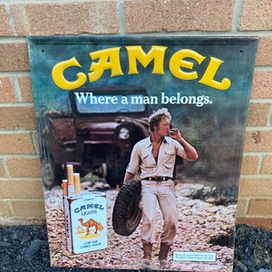 Vintage Tin Embossed Camel Lights “Where A Man Belongs” Sign With Great Color